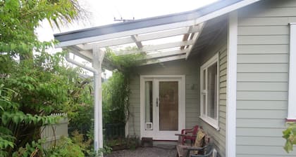 Roa Cottage is a rustic cottage, close to the start of the Paparoa Great walk.