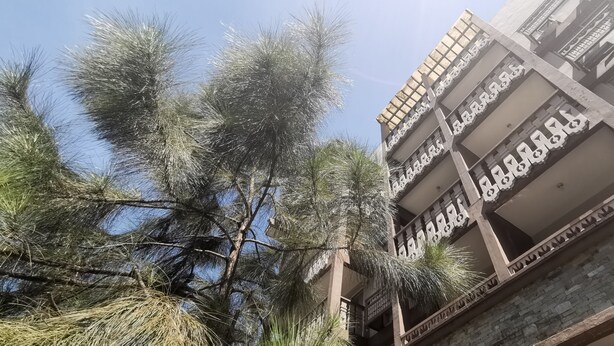 A multi-story building with balconies and a clear sky. - SweetSuites at Pine Crest New Manila / #T3-1012 (Quezon City)