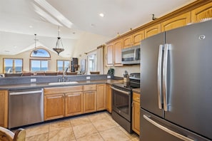 Fridge, microwave, oven, stovetop - 1030 - Ocean to Ocean, a spacious 6-bedroom oceanfront home in Corolla, NC. (Corolla)