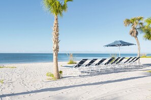 On the beach, sun-loungers, beach towels