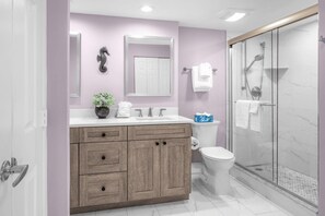 Bathtub, hair dryer, towels, soap