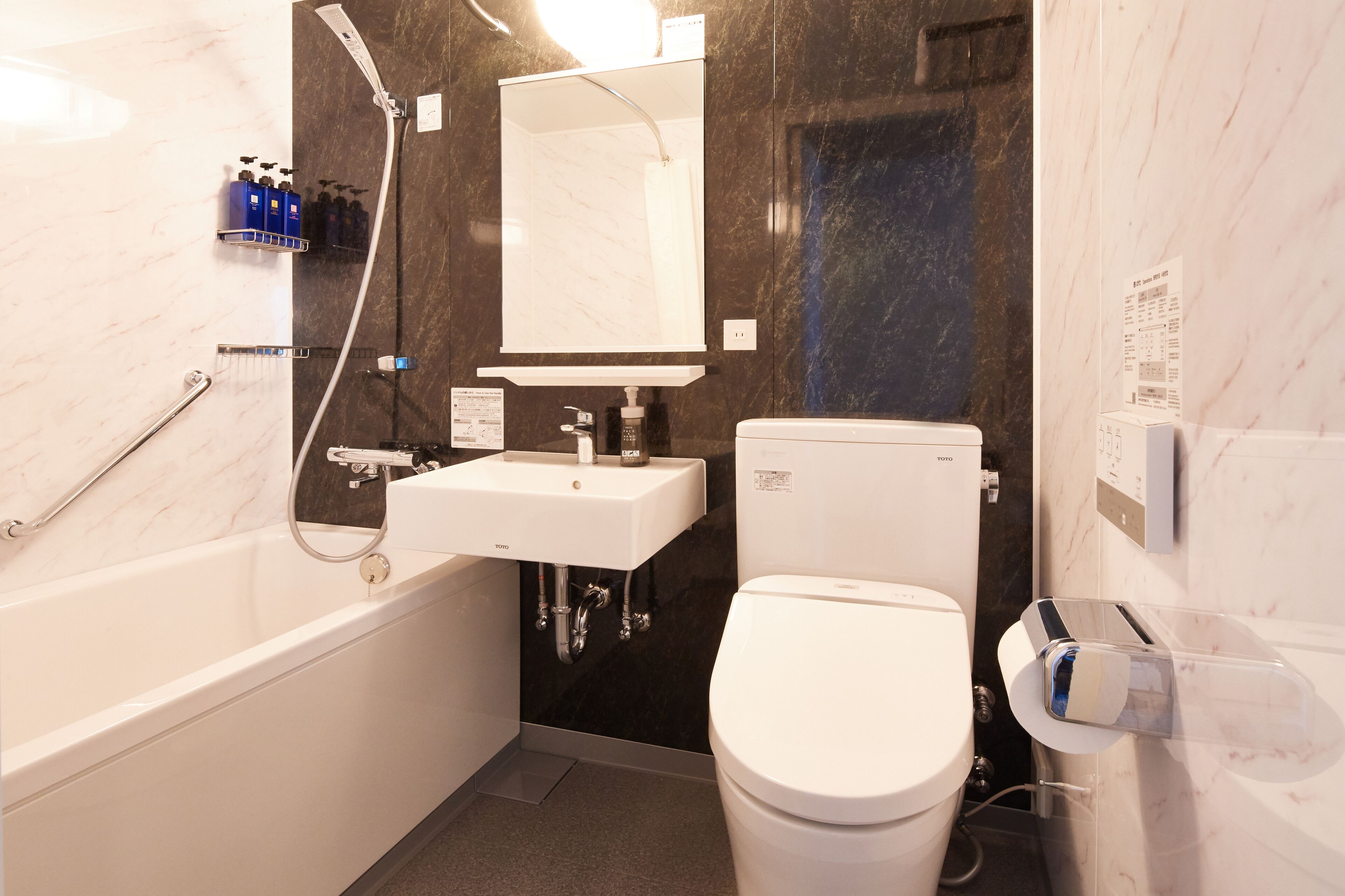 combined shower/bathtub, free toiletries, hair dryer, slippers