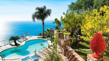 Seasonal outdoor pool, pool umbrellas, pool loungers