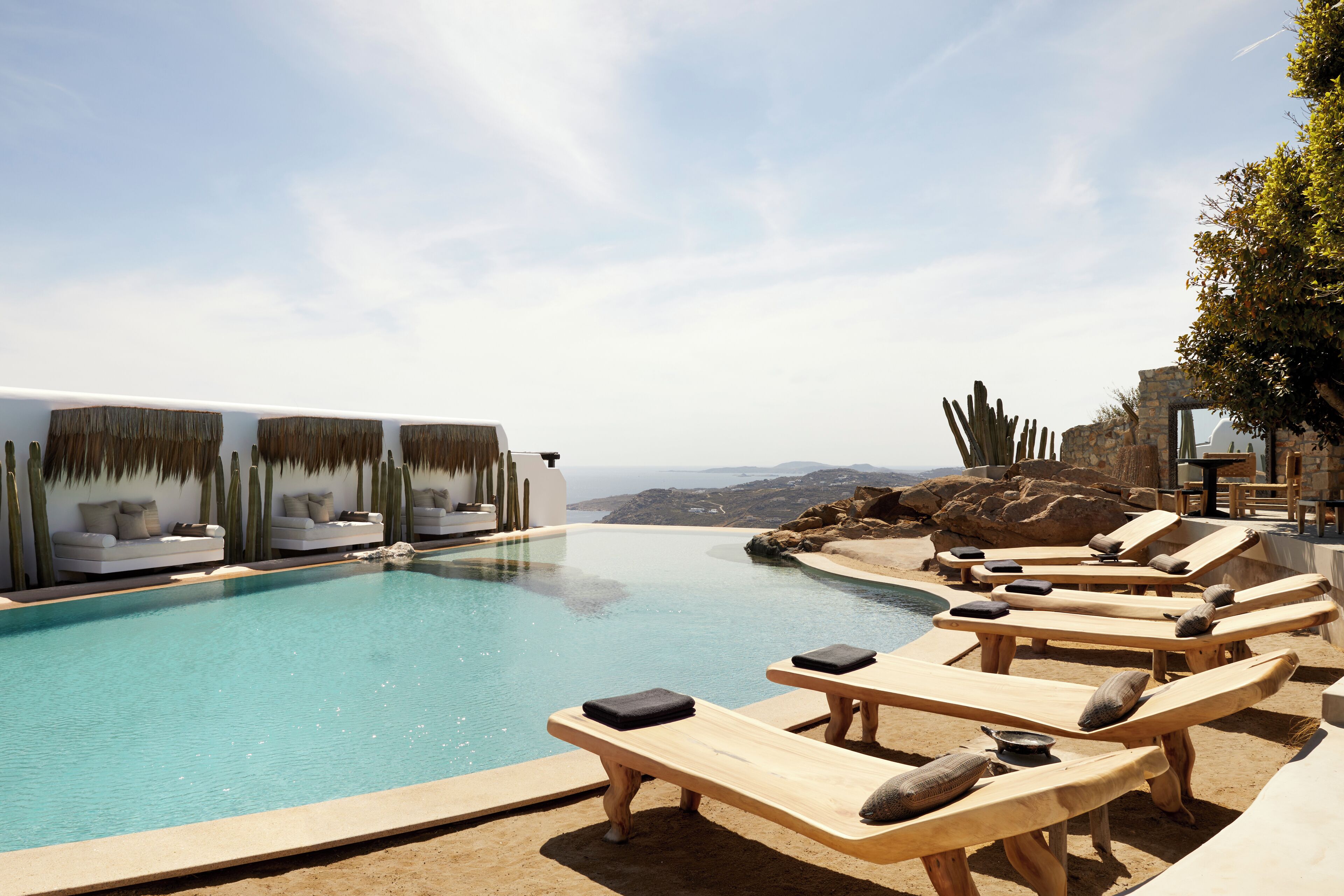 Outdoor pool, open 10:00 AM to 8:00 PM, pool umbrellas, pool loungers
