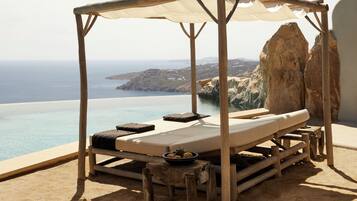 Outdoor pool, open 10:00 AM to 8:00 PM, pool umbrellas, pool loungers