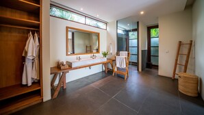 A modern bathroom with a wooden vanity, a large mirror, and a shower area. - 7BR Villa For Large Groups W/Pool Table, Canggu! 9Min Drive To Seminyak Square! (Canggu)