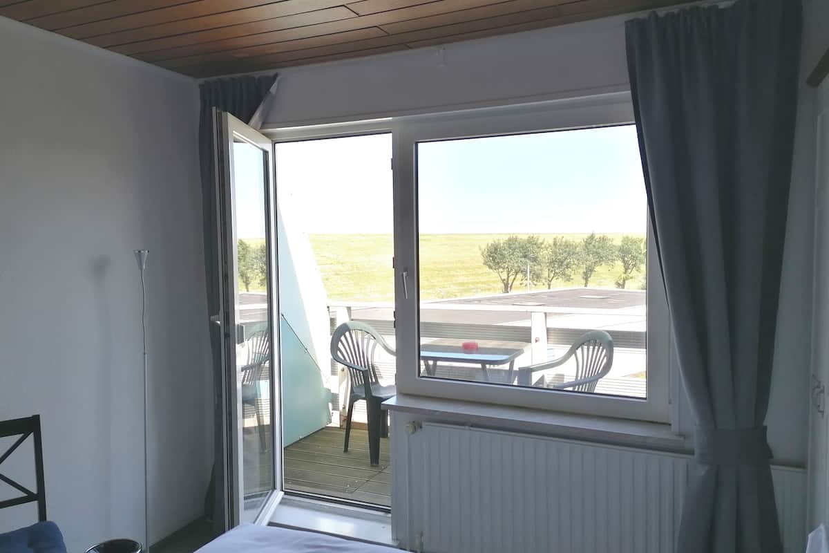 comfort double room, 1 queen bed, non smoking | balcony view