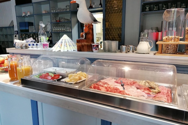 Daily buffet breakfast (EUR 11 per person)