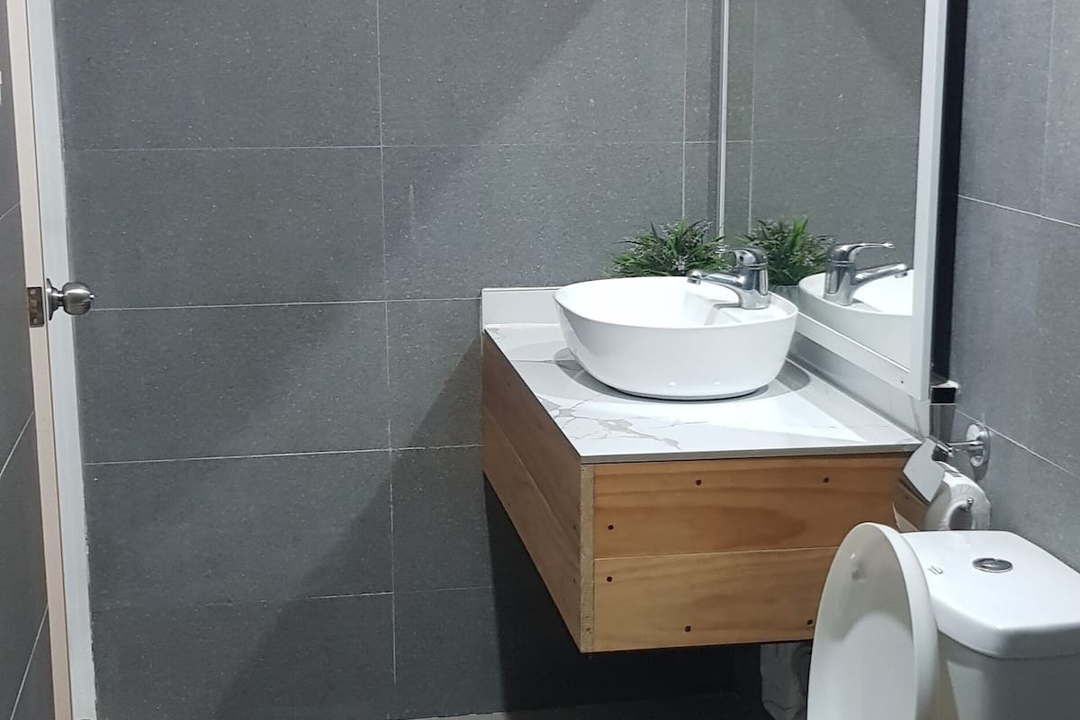 family single room, multiple beds | bathroom | shower, free toiletries, bidet, towels