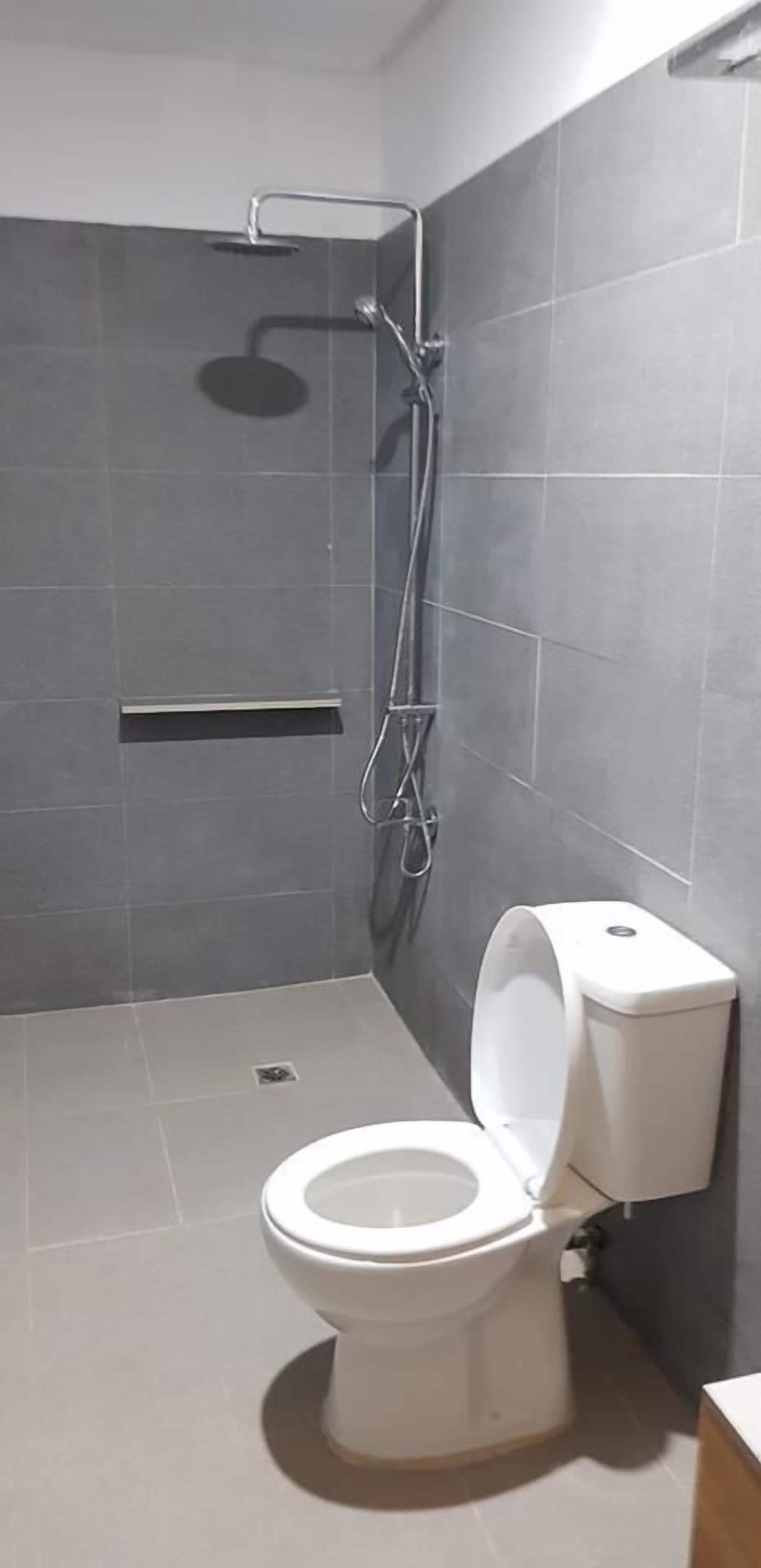 family single room, multiple beds | bathroom | shower, free toiletries, bidet, towels