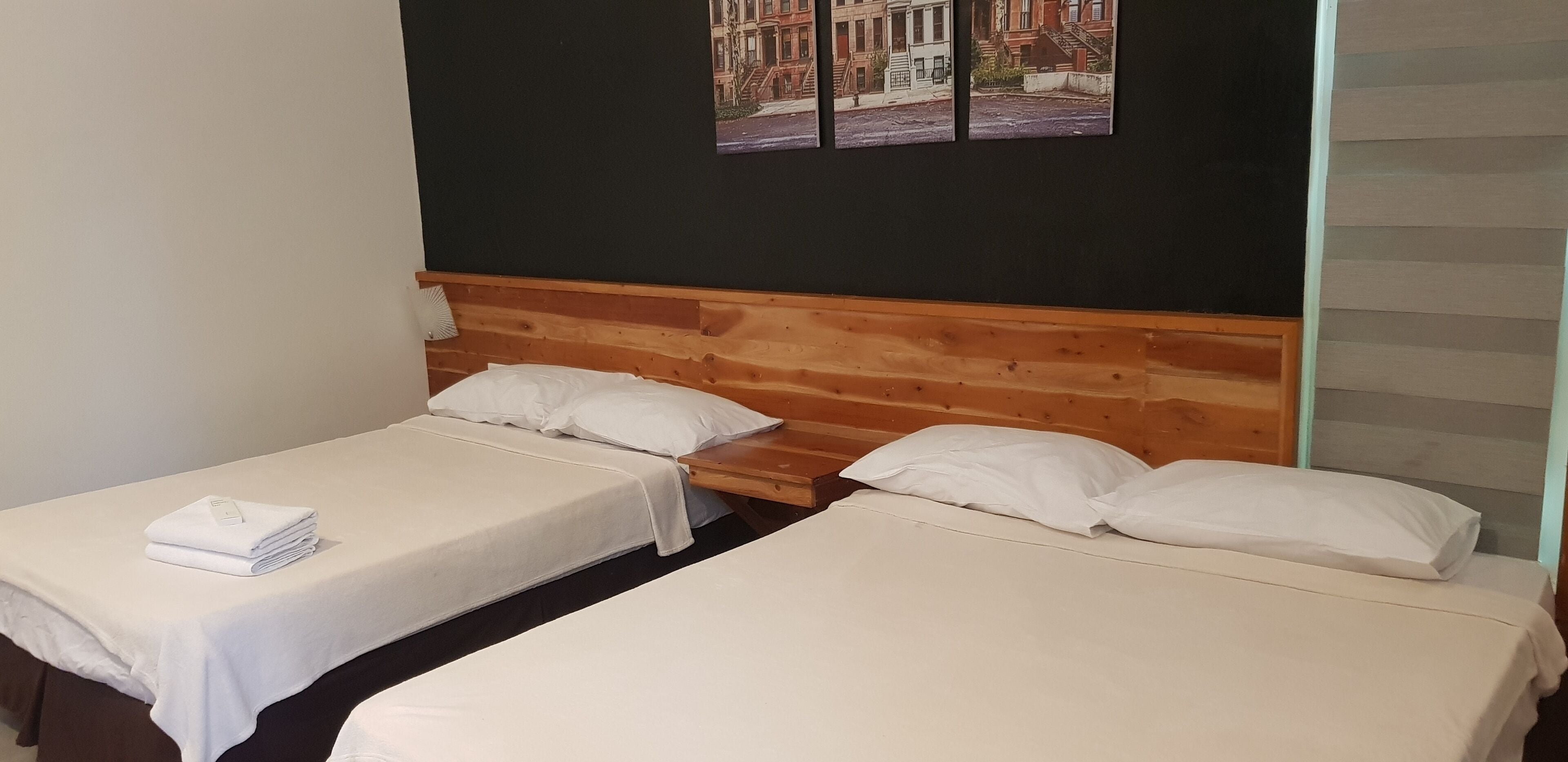 family single room, multiple beds | 1 bedroom, desk, laptop workspace, bed sheets