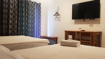 Family Single Room, Multiple Beds | Desk, laptop workspace, bed sheets