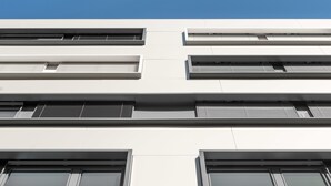 A modern building with multiple windows and a flat facade. - myNext - Hotel Leo (Vienna)