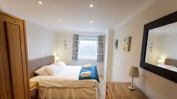 Apartment, 1 Bedroom, Sea View (No Dogs) | 1 bedroom, blackout drapes, iron/ironing board, free WiFi