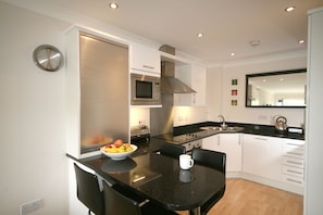 Apartment, 1 Bedroom, Sea View (No Dogs) | Private kitchen | Fridge, microwave, oven, dishwasher - Waves Apartments (Newquay)