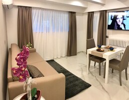 Apartment, 1 Bedroom (Aqua Azzurra) | Living area | Flat-screen TV