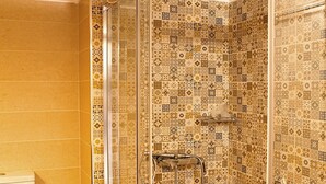 A bathroom with a shower, toilet, and patterned tiles. - Glyfada Center - Aries Newly Modern Home (Glyfada)