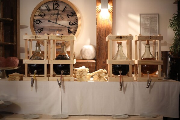 A vintage-style clock with wooden frames and a white tablecloth.