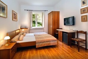 Suíte estúdio família, cozinha, vista para o jardim | Vista do quarto