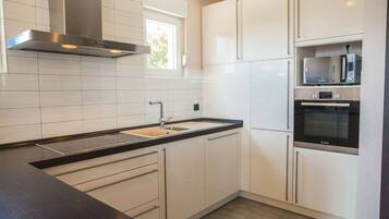 Exclusive Villa | Private kitchen | Fridge, microwave, oven, stovetop