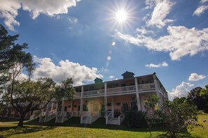 A two-story building with a balcony and a staircase leading to the entrance. - Ruisui Village (Ruisui)