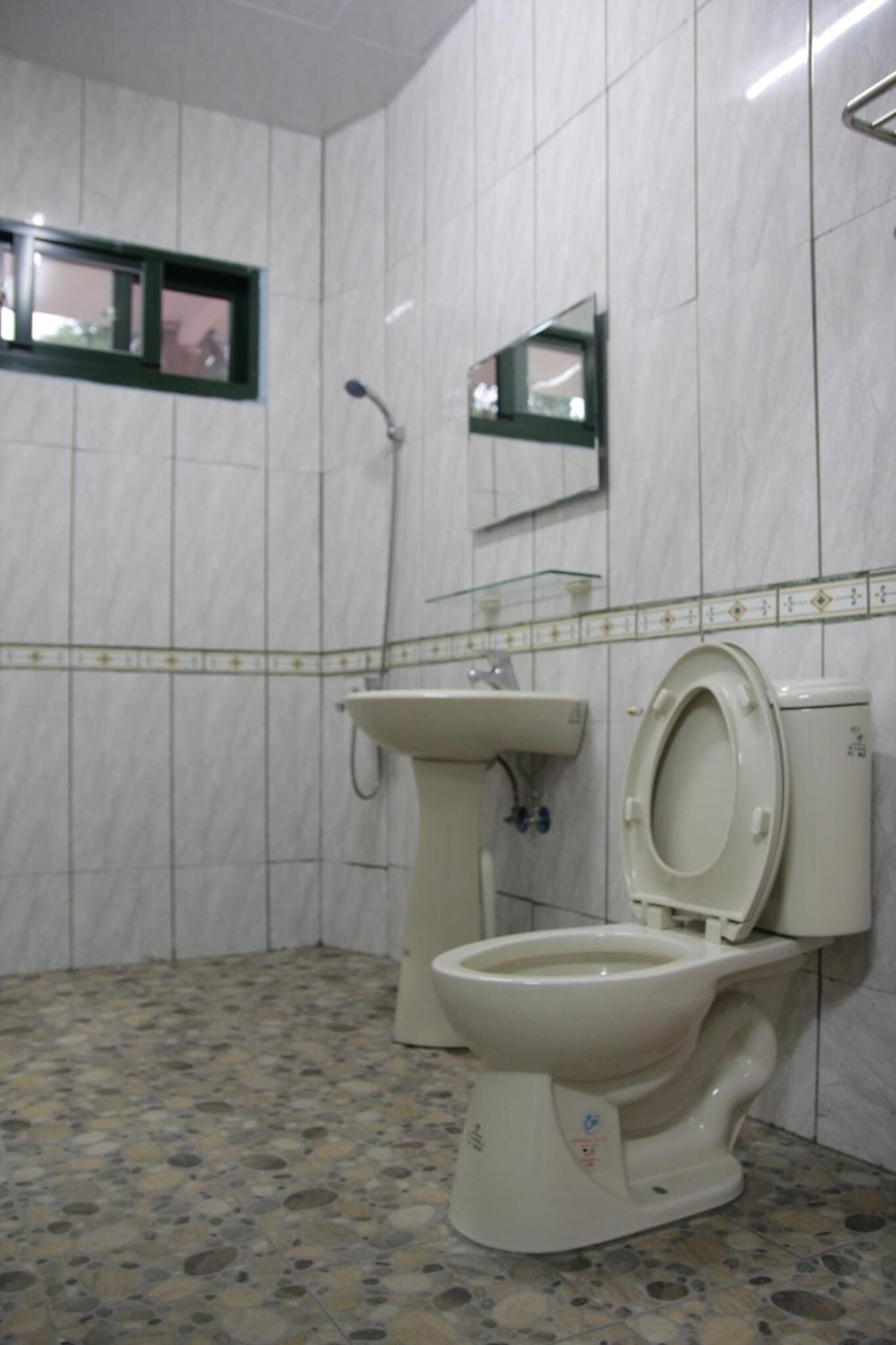 Shower, free toiletries, hair dryer, slippers