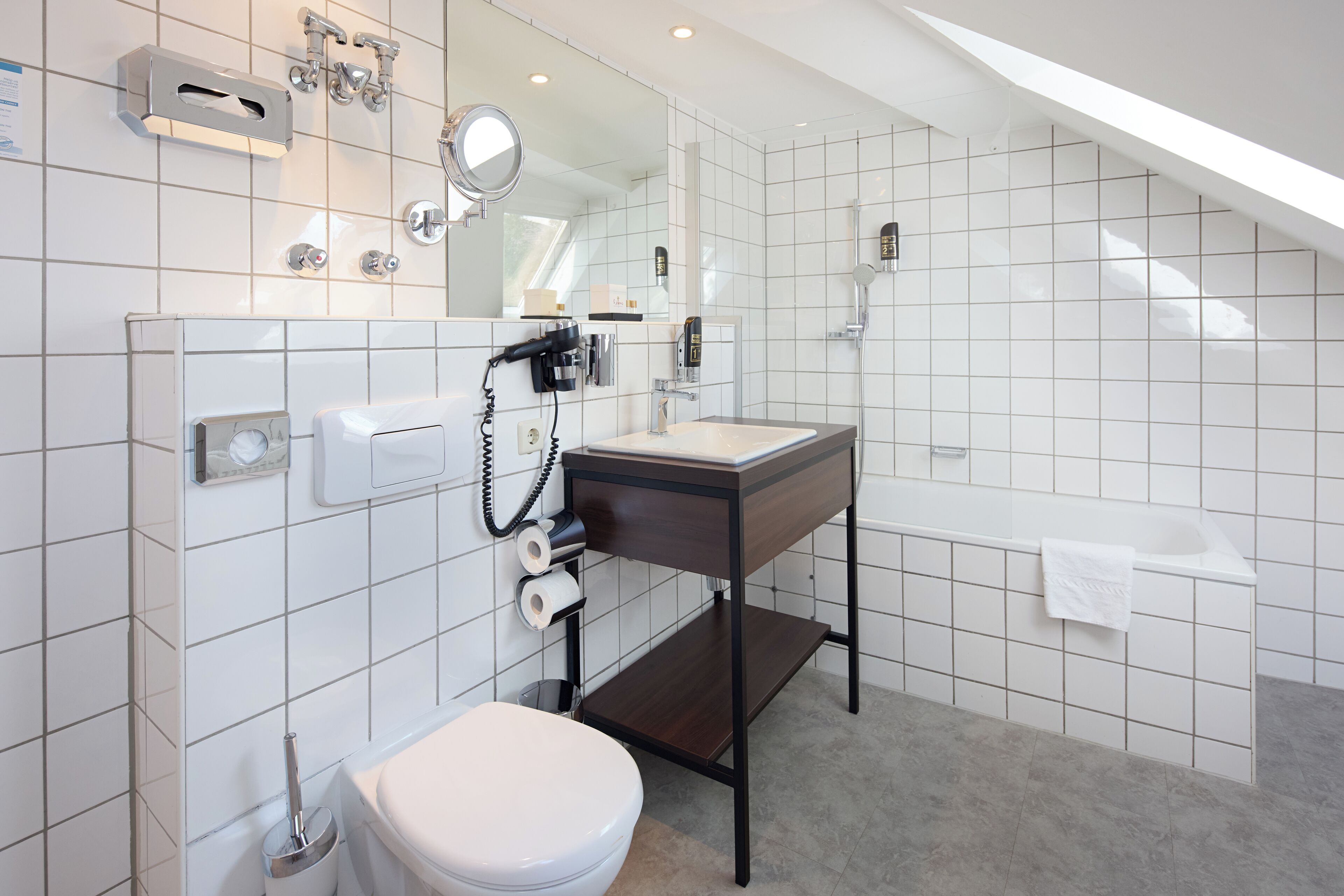 deep-soaking bathtub, free toiletries, hair dryer, bathrobes