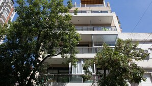 A multi-story building with balconies, large windows, and a flat roof. - Cabrera & Gascon (Buenos Aires)