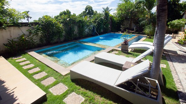 Outdoor pool, open 6:00 AM to 9:30 PM, pool loungers