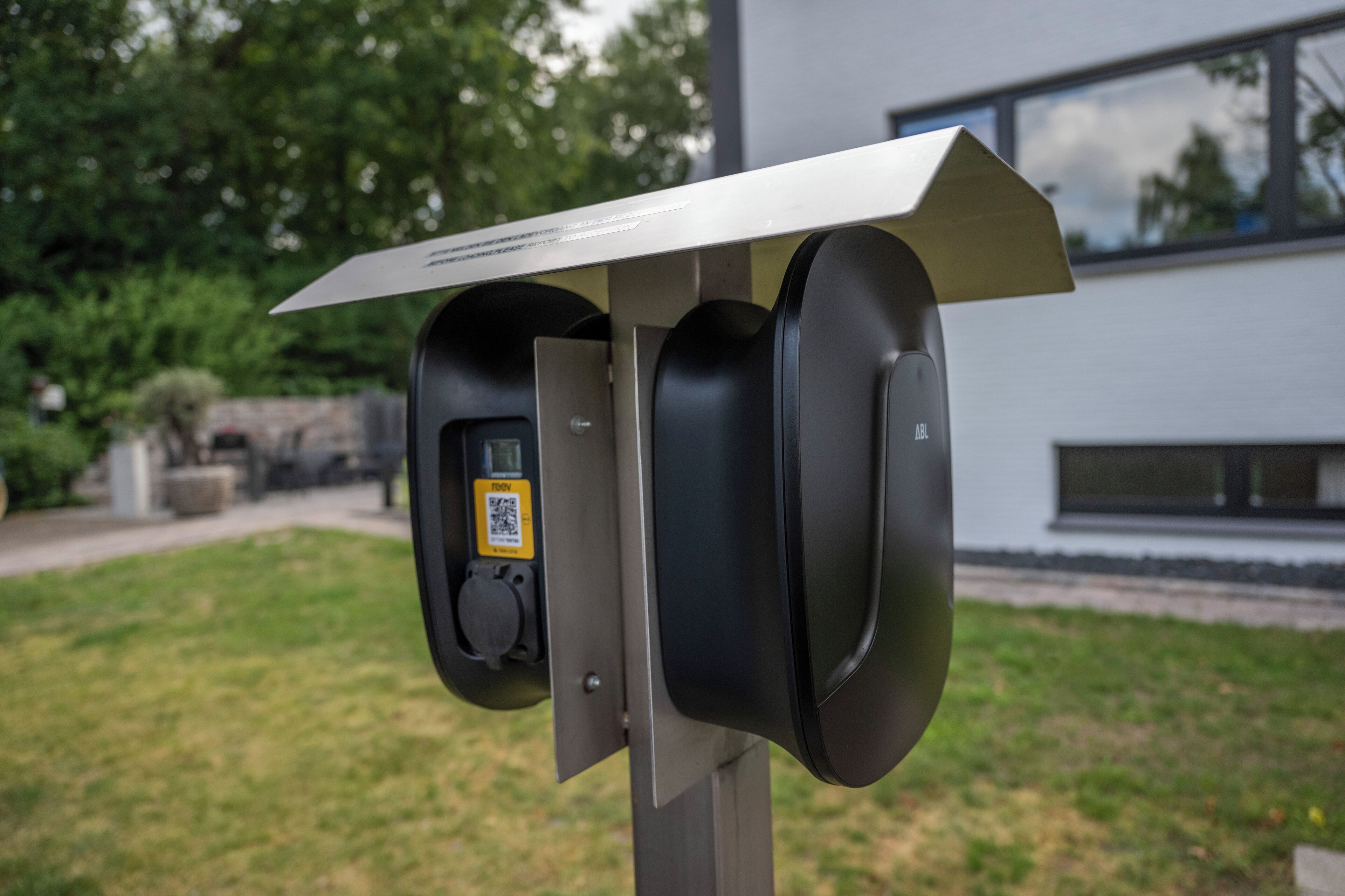 A parking meter with a QR code and a payment button.