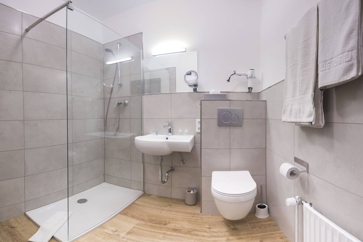 shower, eco-friendly toiletries, hair dryer, towels