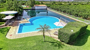 A swimming pool with a view of mountains in the background. - Orange Grove Villa (Nafplio)