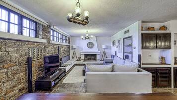 Exclusive Villa, 5 Bedrooms | Living area | 55-inch Smart TV with digital channels, TV, video game console