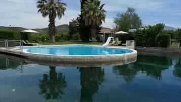 Outdoor pool, pool umbrellas, sun loungers