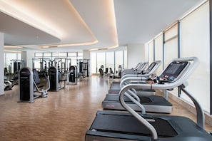 A modern gym with treadmills, weight machines, and free weights. - Holiday Inn Zhengzhou Riverside by IHG (Zhengzhou)