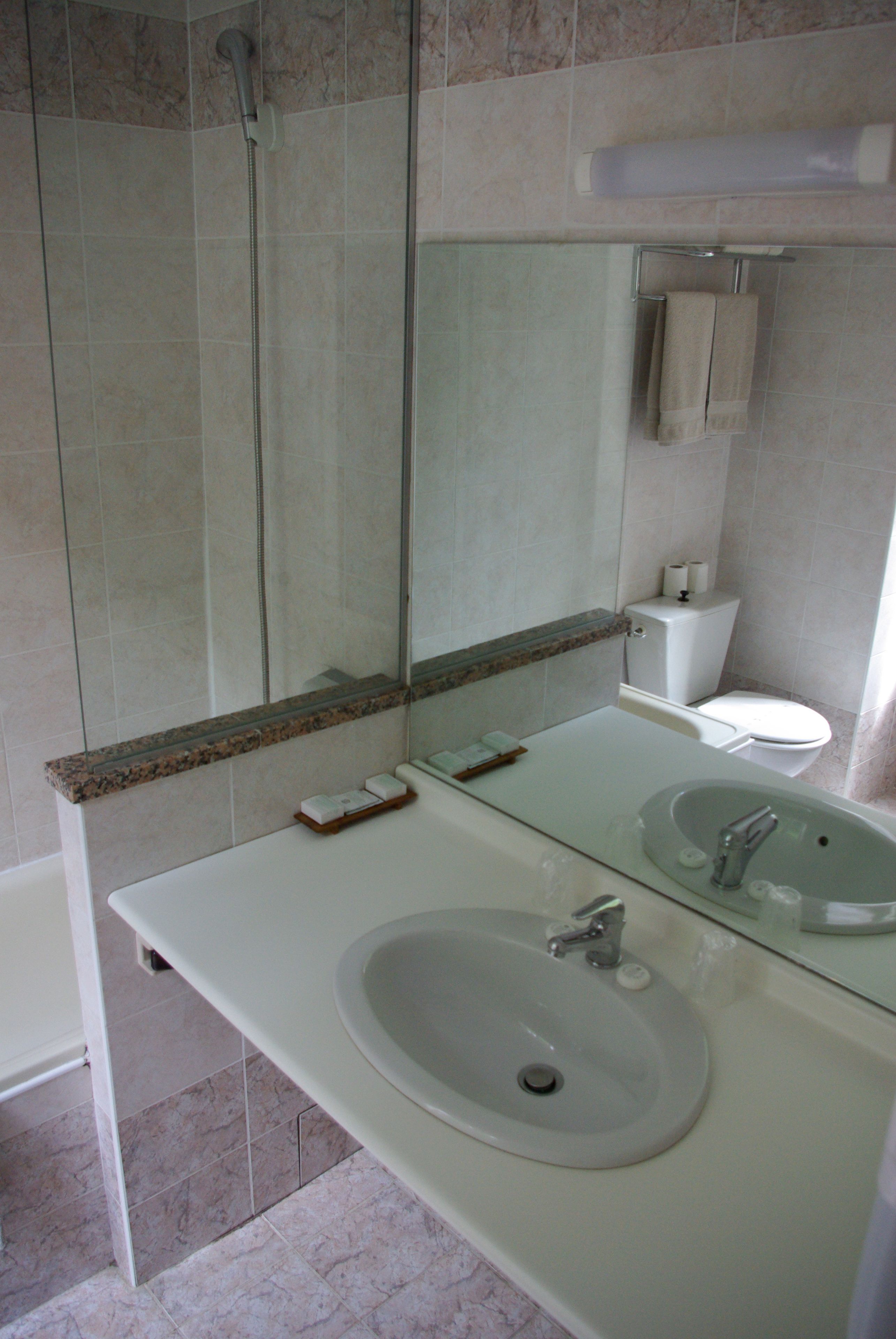 quadruple room, multiple beds | bathroom sink