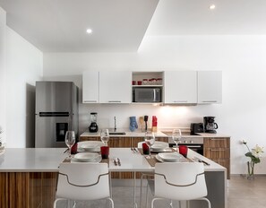 Apartment, 1 Bedroom | Private kitchen | Full-sized fridge, microwave, oven, stovetop - The City by Tulumeando (Playa del Carmen)