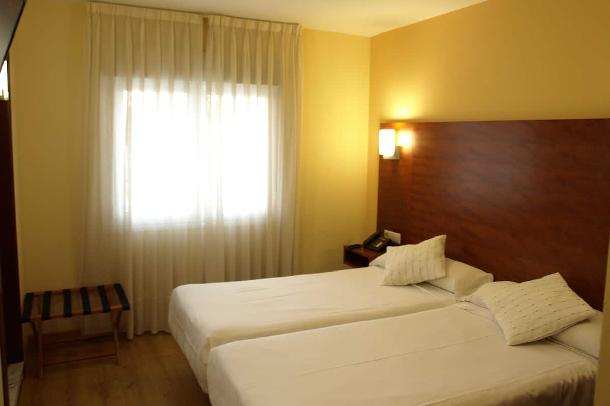 Desk, blackout curtains, soundproofing, rollaway beds