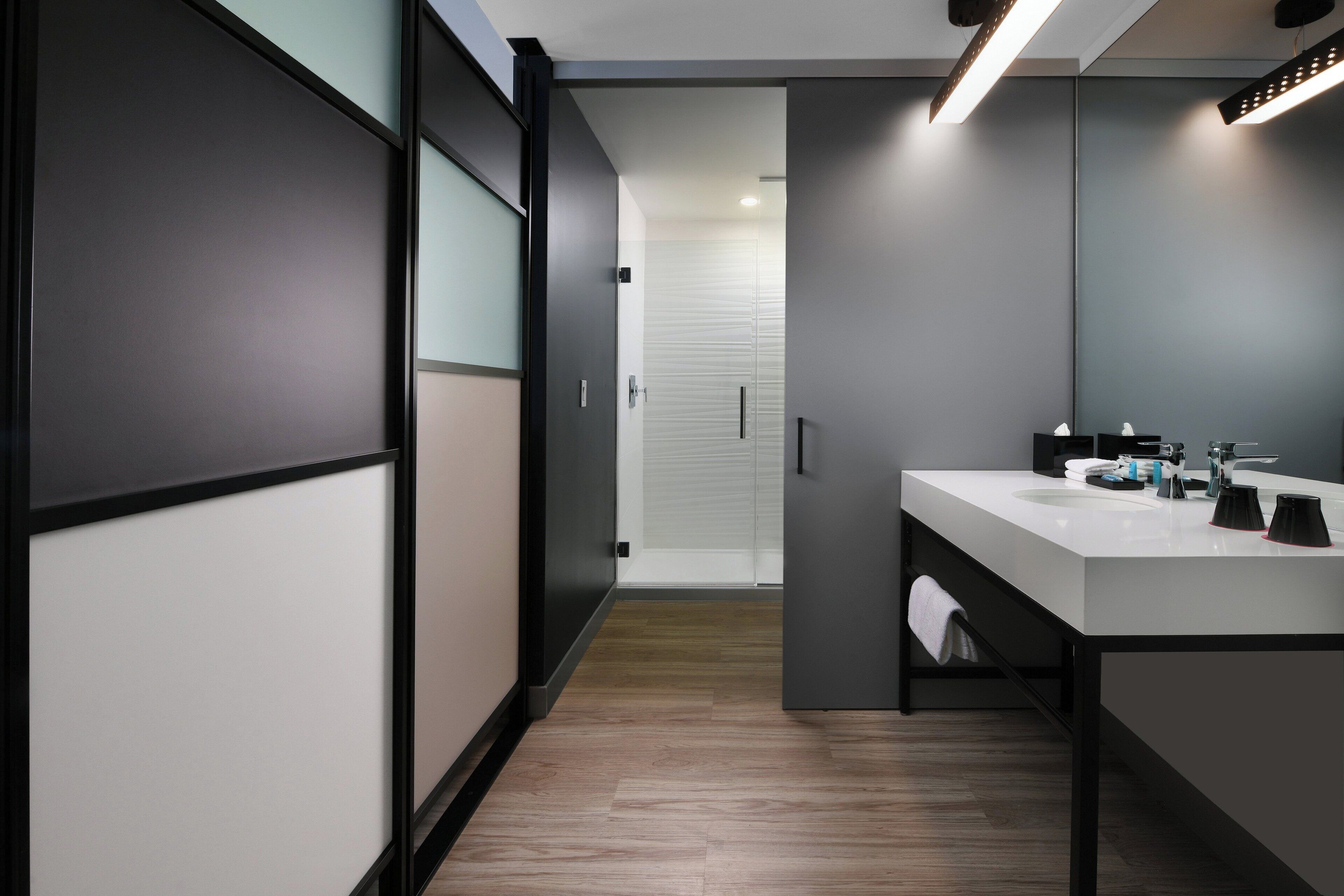 rainfall showerhead, designer toiletries, hair dryer, towels