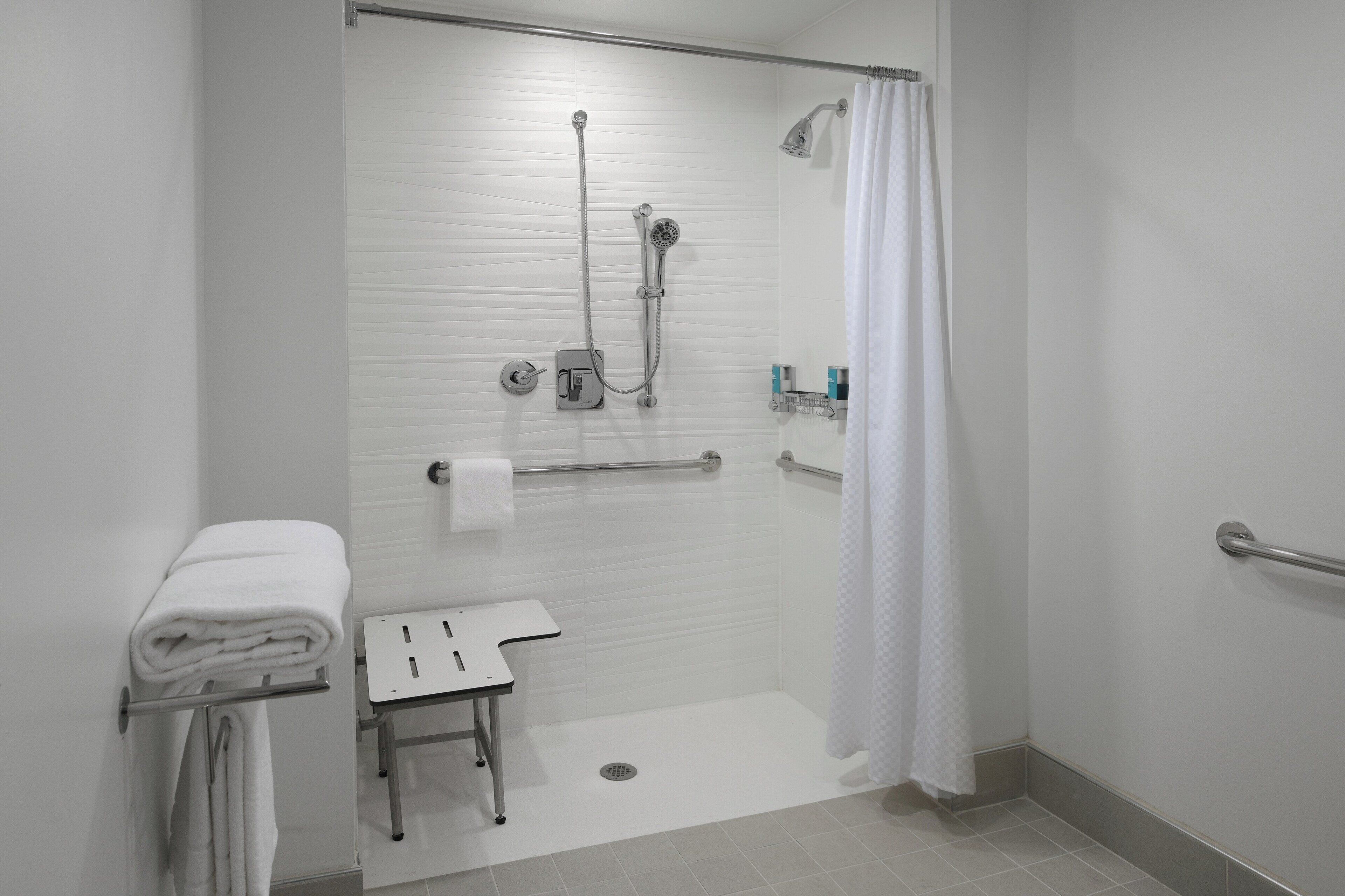 room, 1 king bed, non smoking | bathroom | rainfall showerhead, designer toiletries, hair dryer, towels