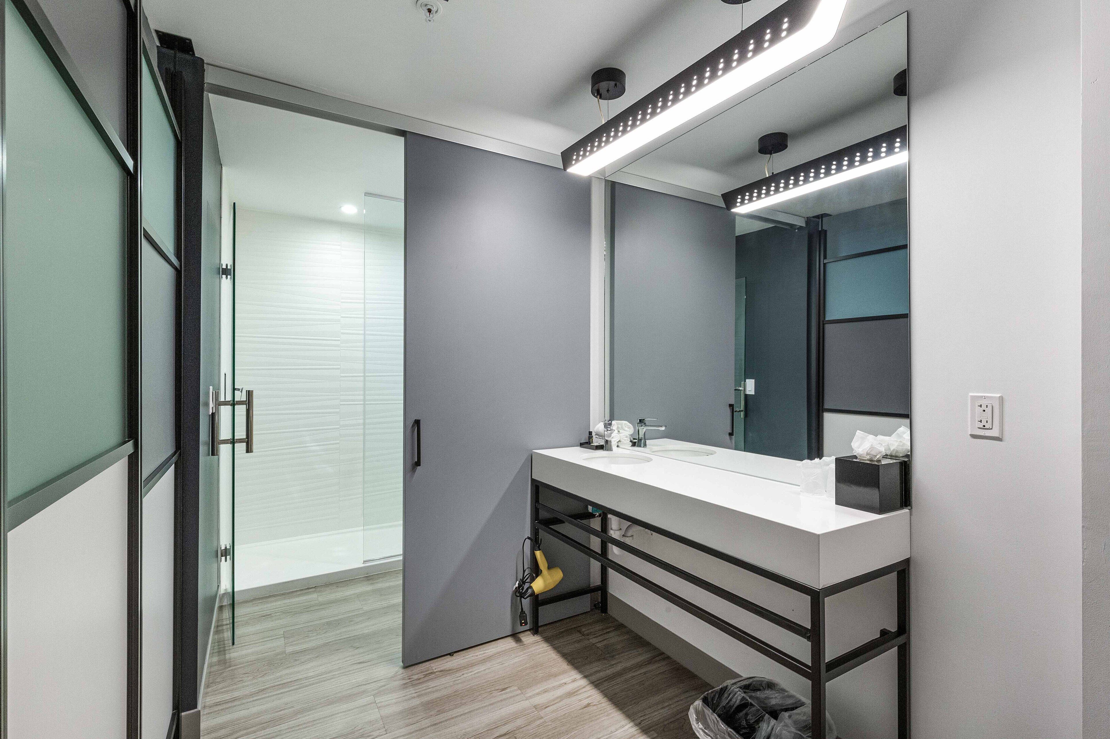 rainfall showerhead, designer toiletries, hair dryer, towels