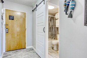 Combined shower/tub, hair dryer, towels, soap