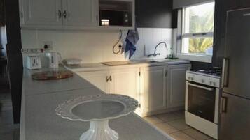 Standard Apartment, 2 Bedrooms | Private kitchen | Full-sized fridge, microwave, stovetop, electric kettle