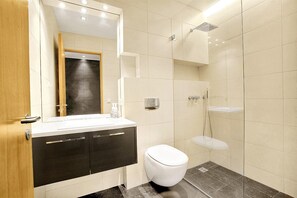 Bathtub, hair dryer, towels, soap