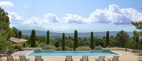 Outdoor pool, a heated pool, sun loungers