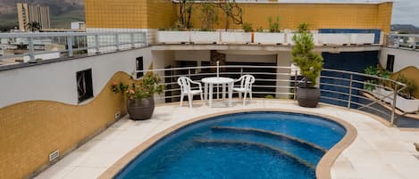 Outdoor pool, open 9:00 AM to 11:00 PM, pool umbrellas, pool loungers