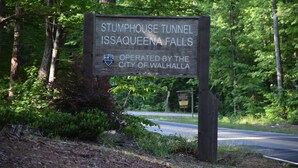 A sign for the Stumphouse Tunnel in Issaquena Falls, operated by the City of Walhalla.