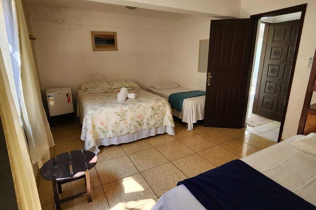 Economy Room, Private Bathroom | Minibar, blackout drapes, free WiFi, bed sheets