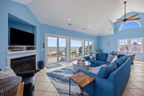 Flat-screen TV, fireplace, DVD player, stereo