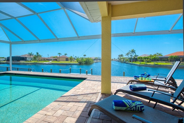 Relax by the pool with a clear view of the surrounding landscape.